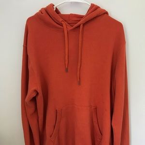 Orange hoodie from Uniqlo